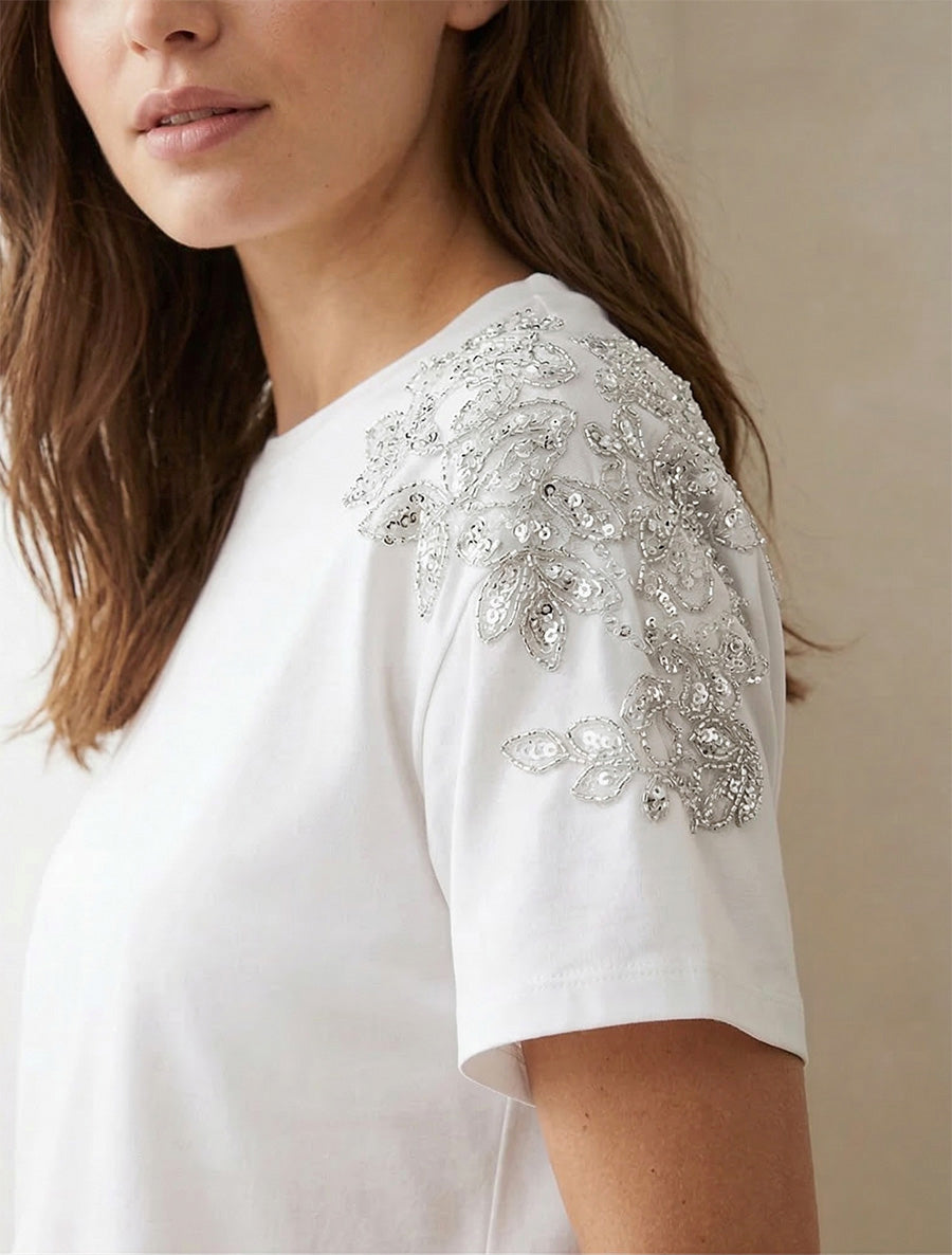 T-shirt met korte mouwen en schouderstrass. - Wit